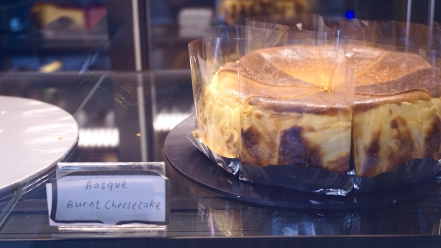 Whole Basque burnt cheesecake in the chiller at 209 Cafe